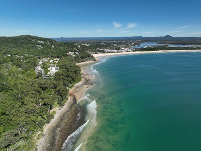 Aerial drone view of Noosa Main Beach and the surrounding coastal area in Queensland, Australia.