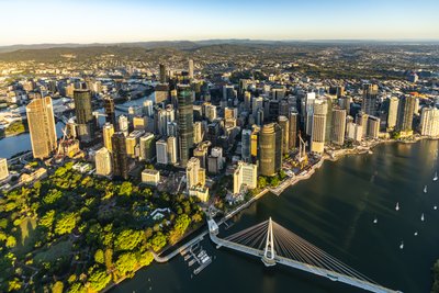 Aerial view over West End, Brisbane's Riverside Drive and the surrounding cityscape.