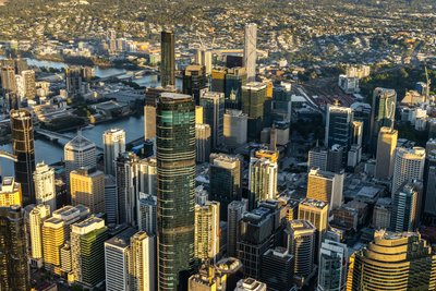 Aerial view over West End, Brisbane's inner city suburb with modern high-rise buildings and the Brisbane River.
