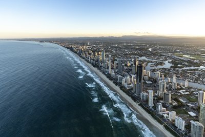 Aerial view along Gold Coast coastline at morning showing Nerang River canals and Surfers Paradise.