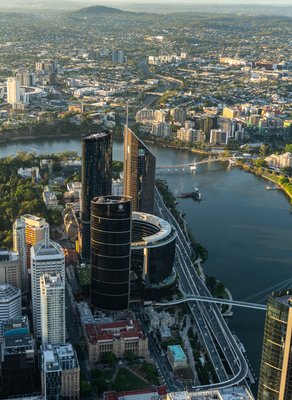 Aerial view of West End, Brisbane's riverside district featuring modern high-rises and iconic landmarks.