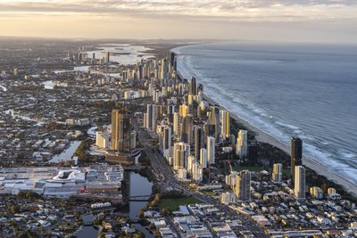 Aerial sunrise view of Broadbeach with Surfers Paradise towers and Gold Coast coastline to the north.