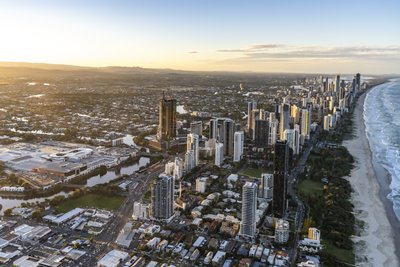 Golden hour aerial of Gold Coast showing Broadbeach and Surfers Paradise skyline from the west.
