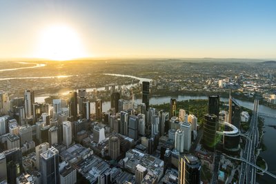 Aerial view over West End, Brisbane at sunset.