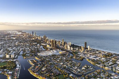 Aerial view of Gold Coast's extensive canal waterways, Surfers Paradise skyline and ocean.