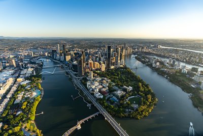Aerial view over West End, Riverside Drive and the Brisbane city skyline.