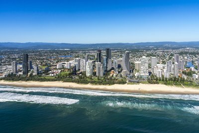 Aerial view of the Surfers Paradise beach precinct with high-rise towers and the Pacific Ocean in Queensland, Australia.