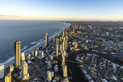 Aerial view of Gold Coast with Nerang River canal system and Surfers Paradise towers at morning.