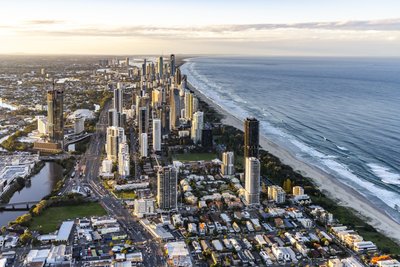 Aerial view over Broadbeach looking north toward Surfers Paradise towers at golden hour.