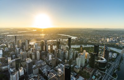 Aerial view of Brisbane City Centre at sunset.