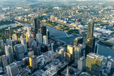 Aerial view over West End, Brisbane's inner city suburb with modern skyscrapers and the Story Bridge.